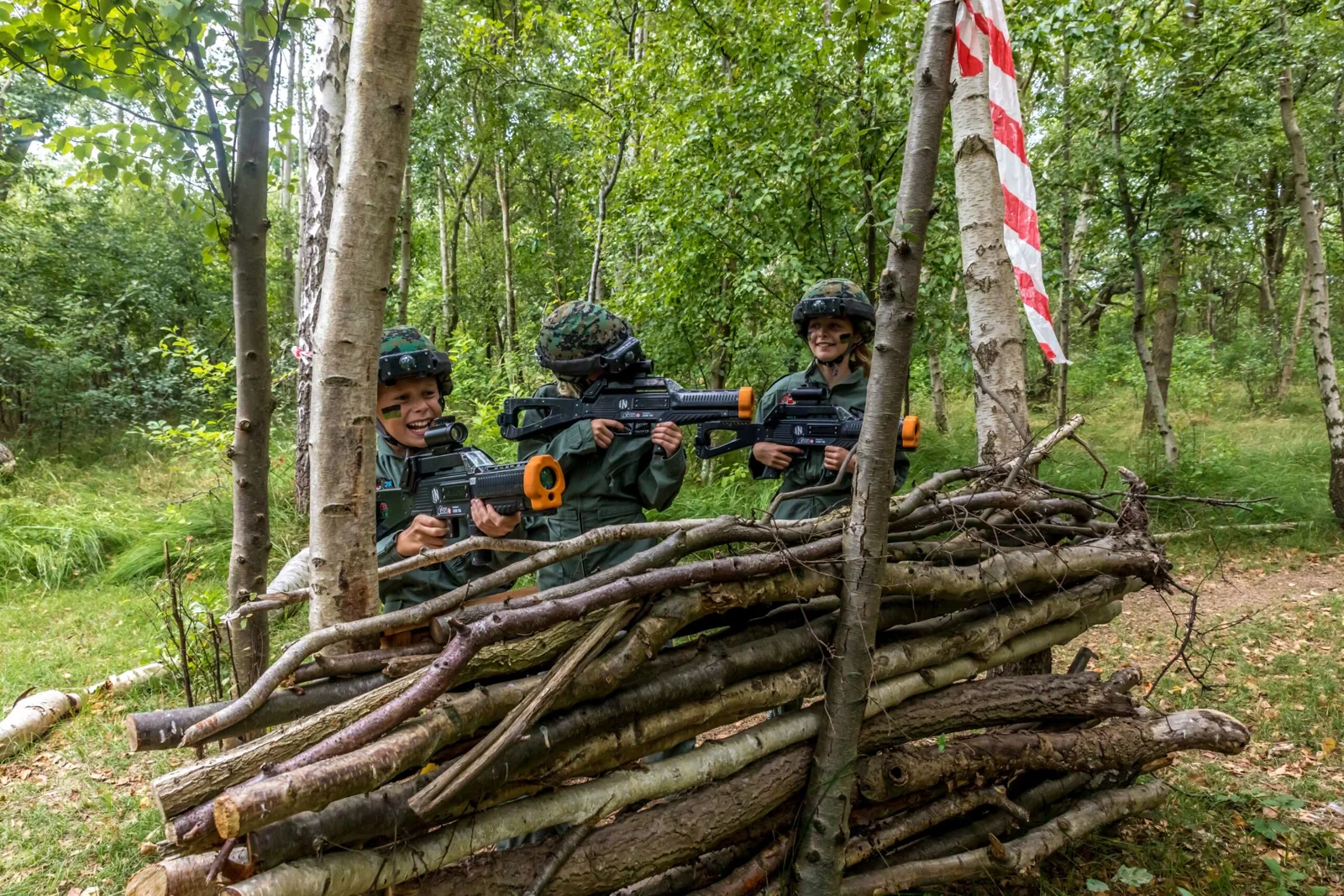 Family playing LaserGame Forest at Veluwse Poort